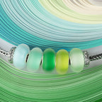 Elfbeads Yellow-Green Frost green; silver glass Bead by The Alternative Bead. Your official Elfbeads Retailer from Germany