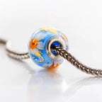 VIP-CHARMS Sky Harmony Bead blue; white; orange glass Bead by The Alternative Bead. Your official VIP-CHARMS Retailer from Germany