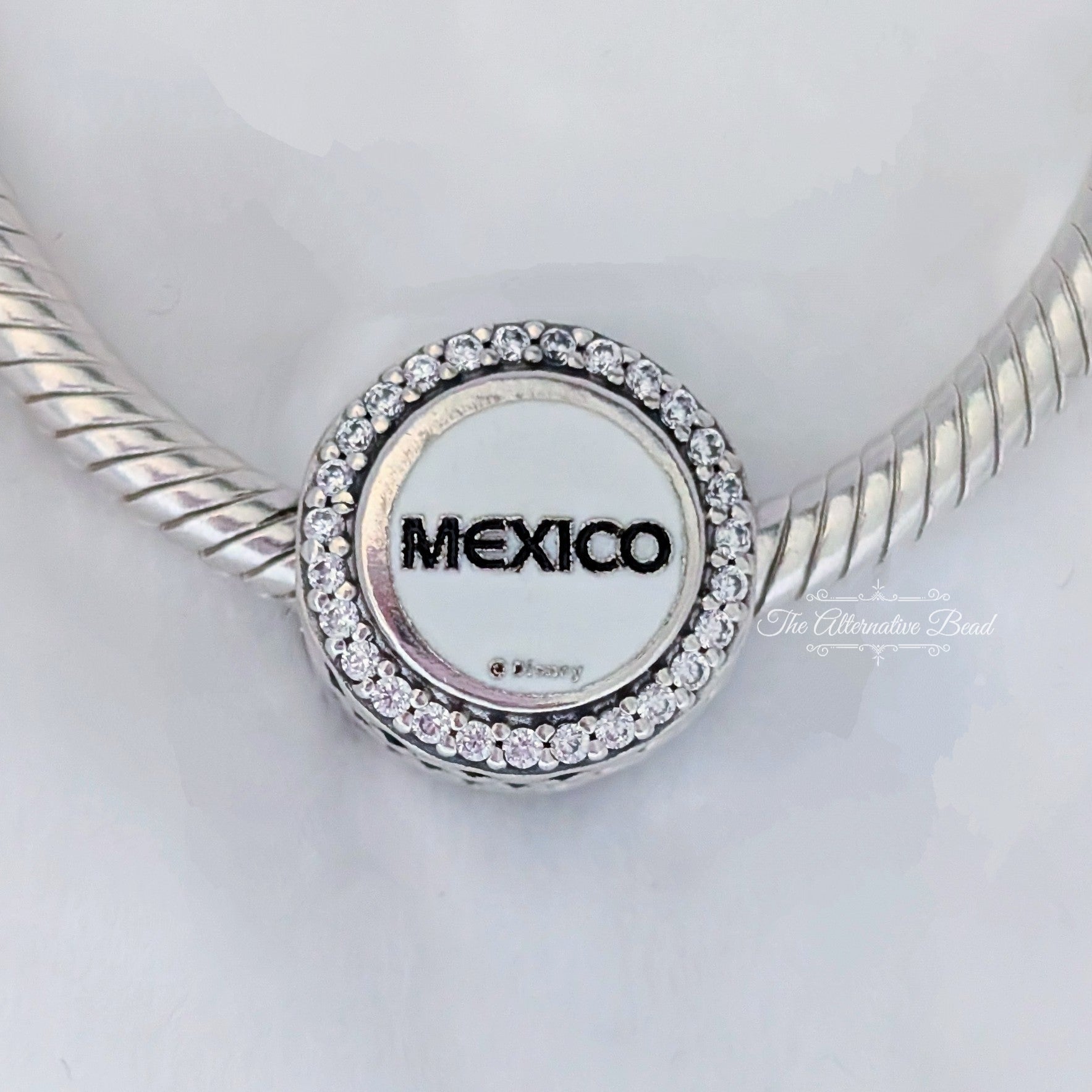 Disney x Pandora Mickey Mouse Mexico (EPCOT World Showcase) silver and white and blue and beige sterling-silver and enamel Bead by The Alternative Bead. Your official Disney x Pandora Retailer from Germany