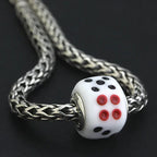 OHM Beads GOTM NO. 53 Lucky Roll white; dots glass Bead by The Alternative Bead. Your official OHM Beads Retailer from Germany