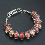 OHM Beads Rust And Reverie red glass Bead by The Alternative Bead. Your official OHM Beads Retailer from Germany