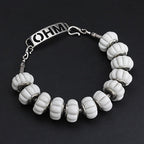 OHM Beads Sow the Ghost's Garden white glass Bead by The Alternative Bead. Your official OHM Beads Retailer from Germany