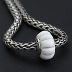 OHM Beads Sow the Ghost's Garden white glass Bead by The Alternative Bead. Your official OHM Beads Retailer from Germany