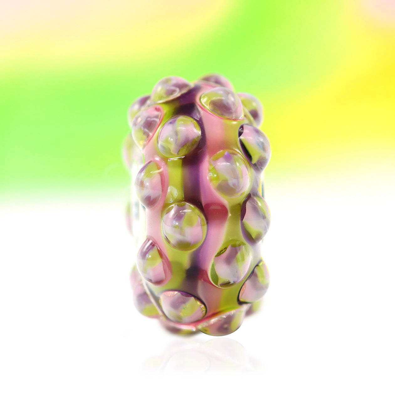 Ogerbeads Bead of the Month November – 2024 pink and green and purple glass Bead by The Alternative Bead. Your official Ogerbeads Retailer from Germany