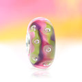 Ogerbeads Bead of the Month October – 2024 pink and green and purple glass Bead by The Alternative Bead. Your official Ogerbeads Retailer from Germany