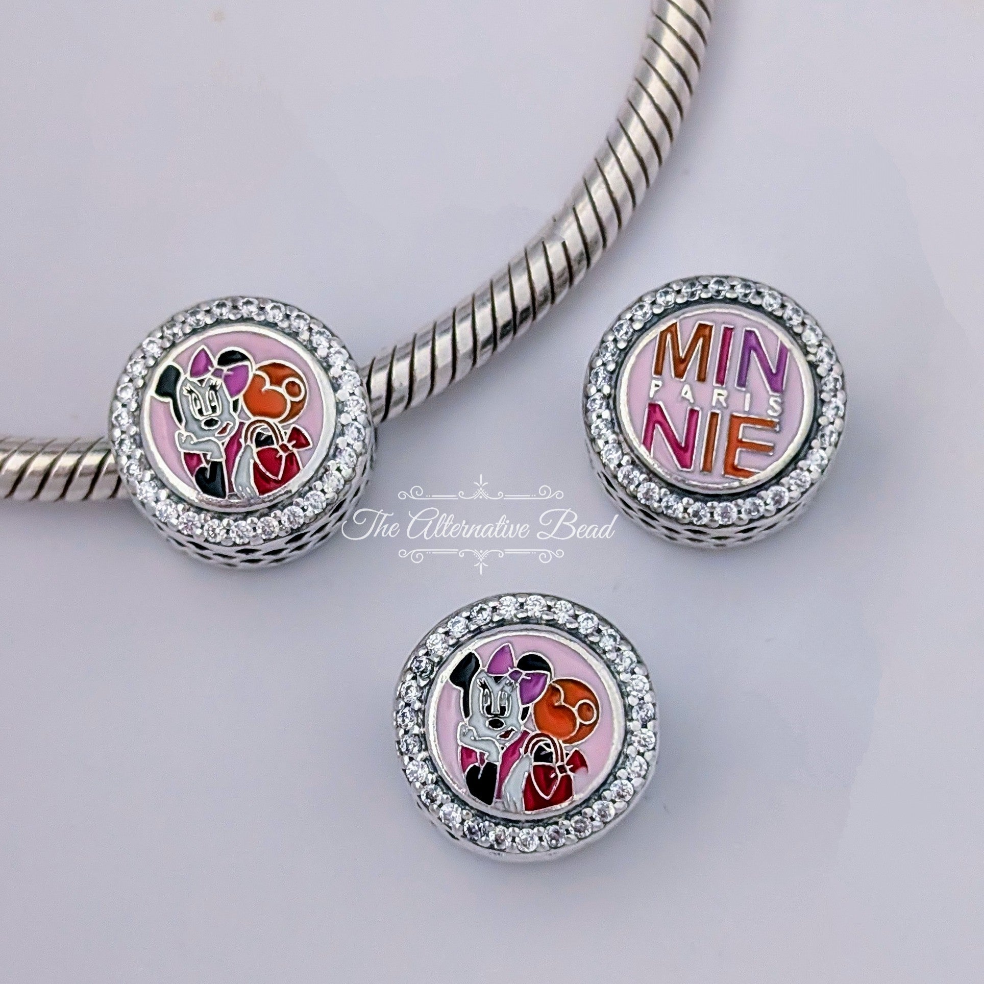 Disney x Pandora Disneyland Paris 30th Anniversary Minnie Paris Style pink sterling-silver and enamel Bead by The Alternative Bead. Your official Disney x Pandora Retailer from Germany