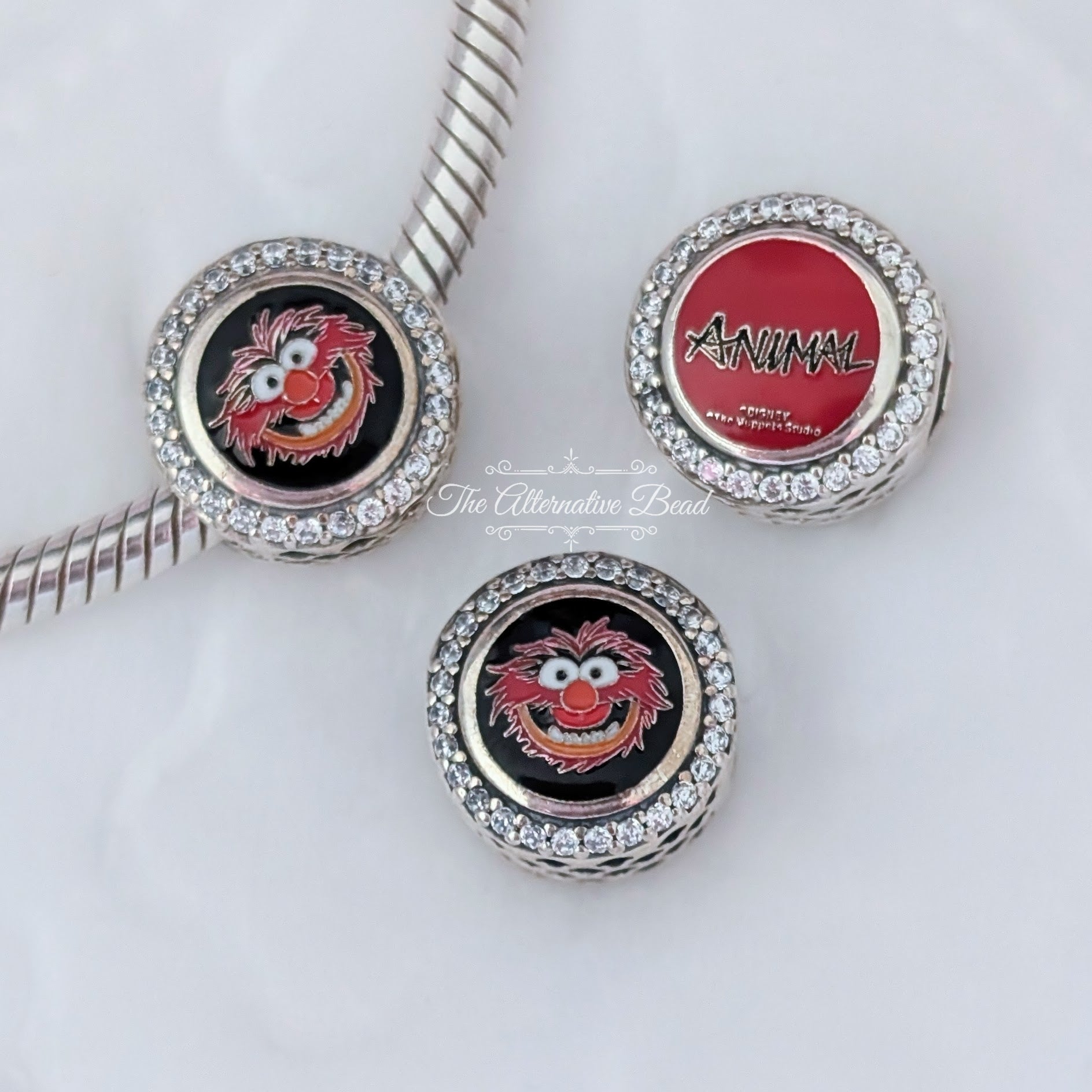 Disney x Pandora Animal Button Charm silver and red sterling-silver and enamel Bead by The Alternative Bead. Your official Disney x Pandora Retailer from Germany
