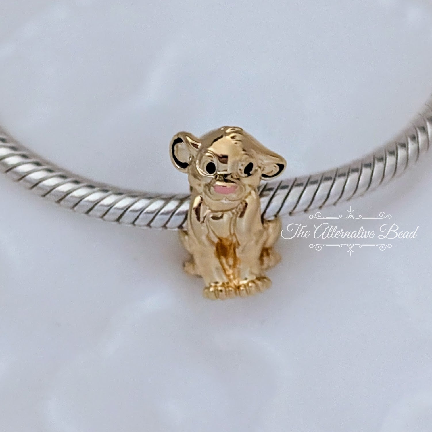 Disney x Pandora Simba Gold Plated Slide Charm gold sterling-silver and gold Bead by The Alternative Bead. Your official Disney x Pandora Retailer from Germany