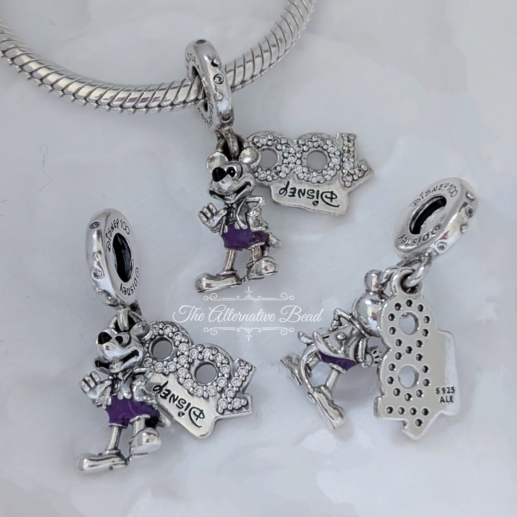 Disney x Pandora Disney 100th Anniversary Mickey Dangle silver and purple sterling-silver and enamel Dangle by The Alternative Bead. Your official Disney x Pandora Retailer from Germany