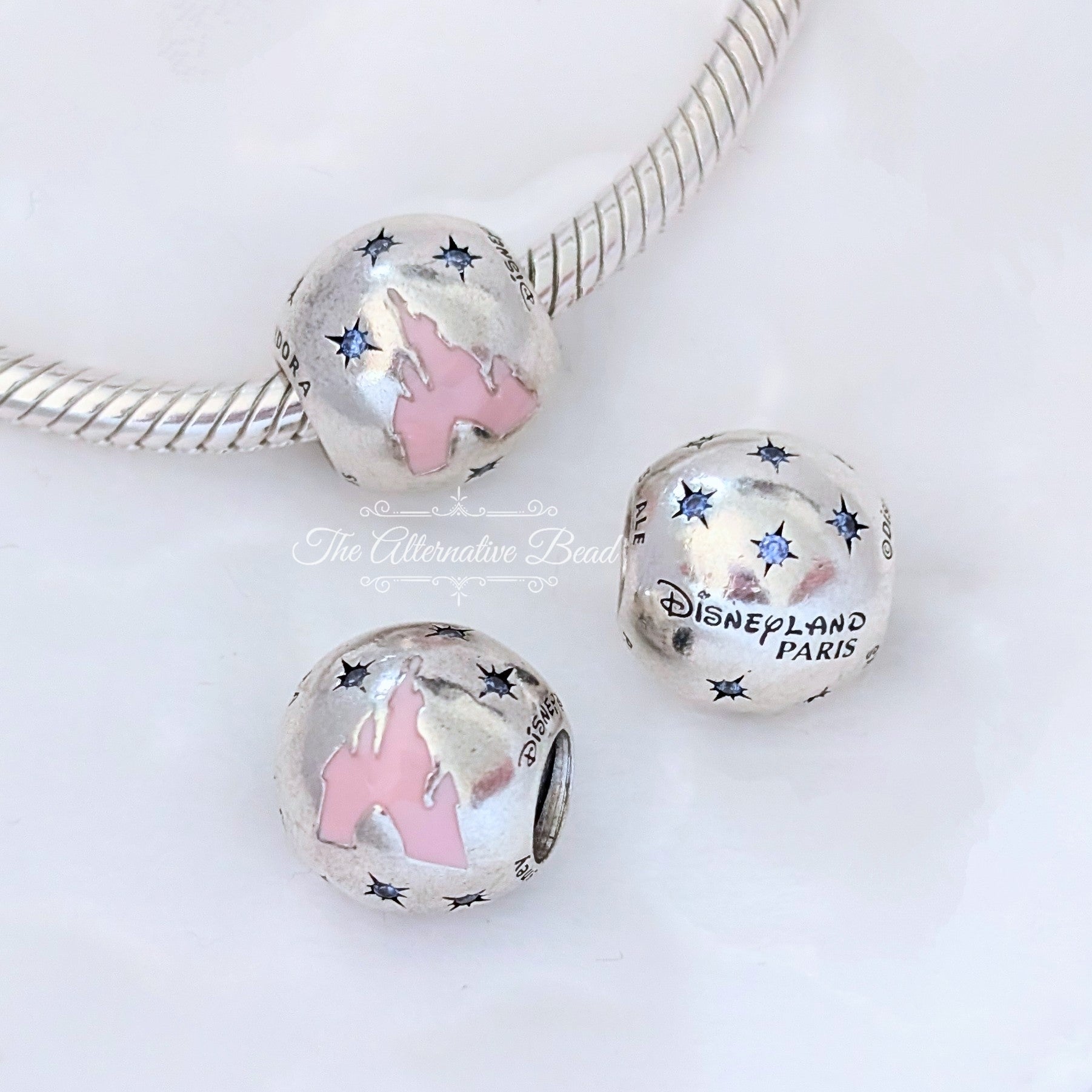 Disney x Pandora Disneyland Paris Silver Castle silver and pink sterling-silver and enamel Bead by The Alternative Bead. Your official Disney x Pandora Retailer from Germany