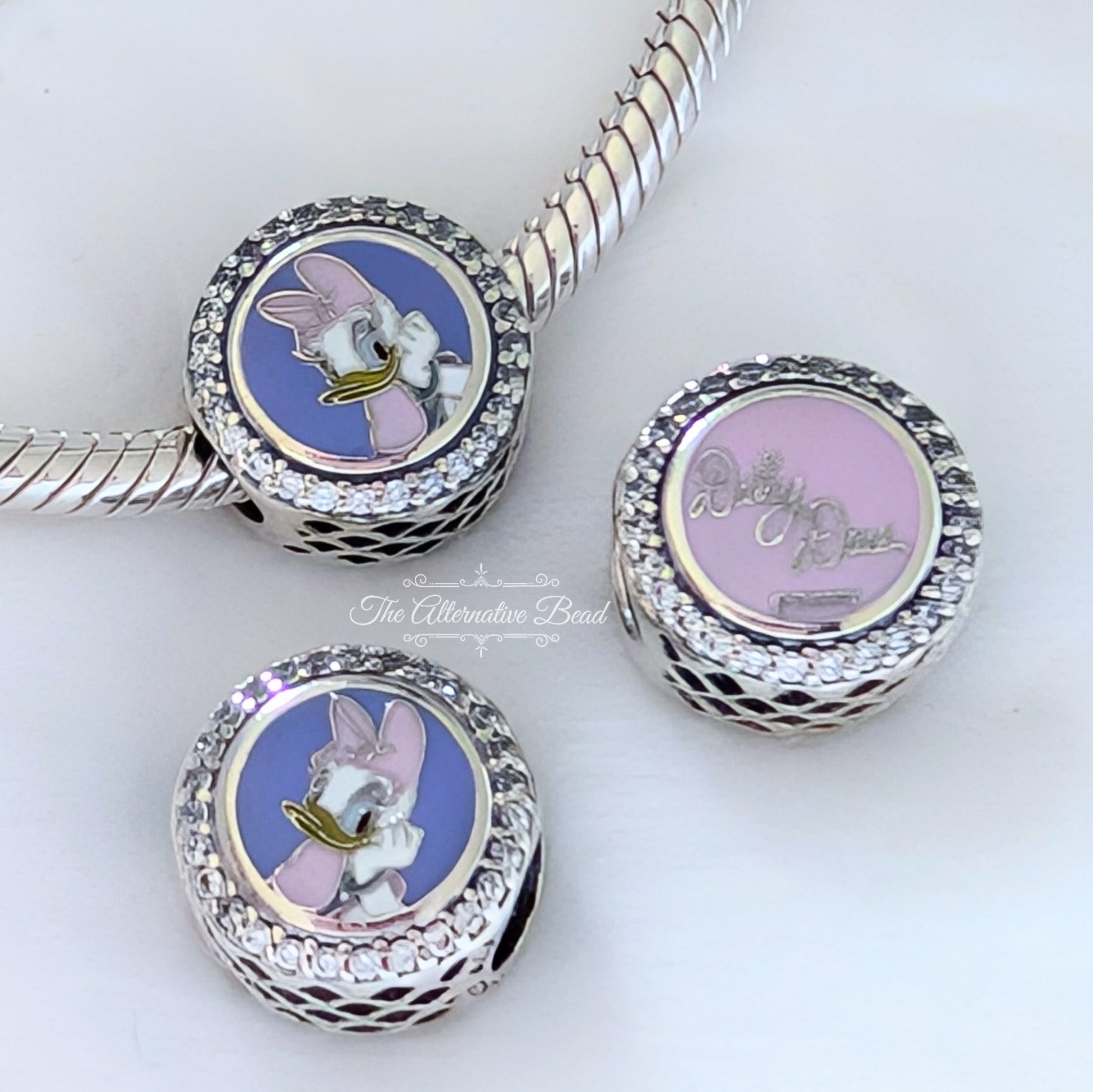 Disney x Pandora Daisy Duck Autograph pink and purple sterling-silver and enamel Bead by The Alternative Bead. Your official Disney x Pandora Retailer from Germany