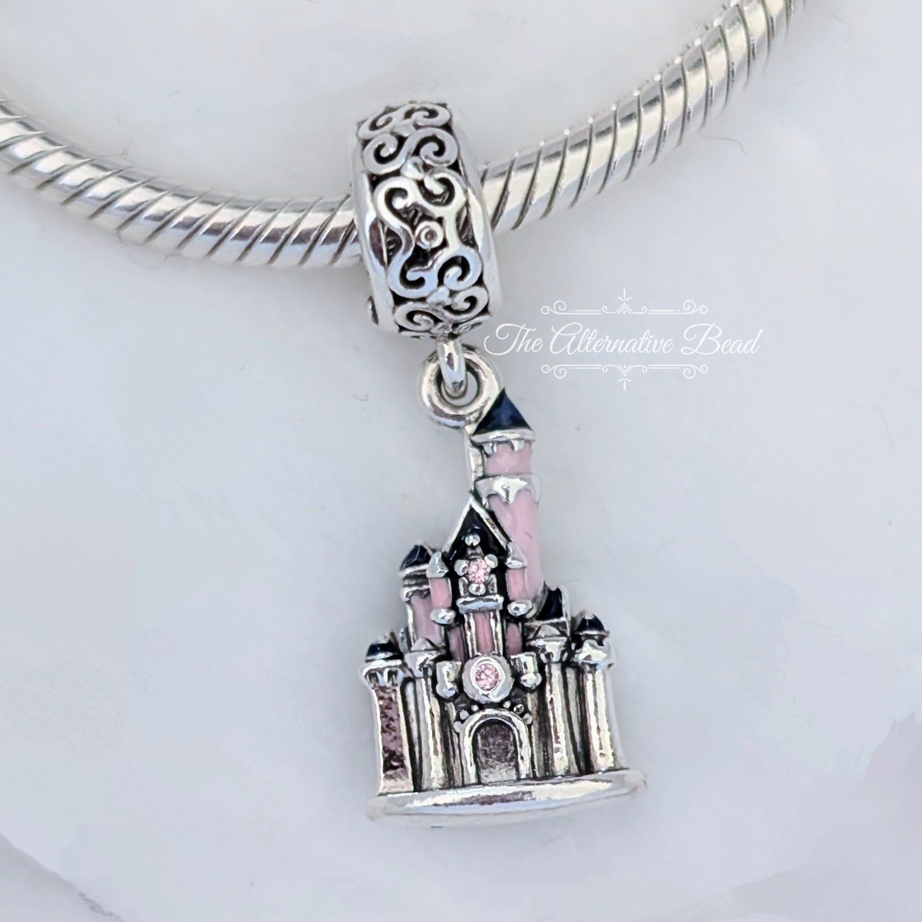 Disney x Pandora Sleeping Beauty Castle Dangle (Disneyland USA) silver and pink sterling-silver and enamel Dangle by The Alternative Bead. Your official Disney x Pandora Retailer from Germany