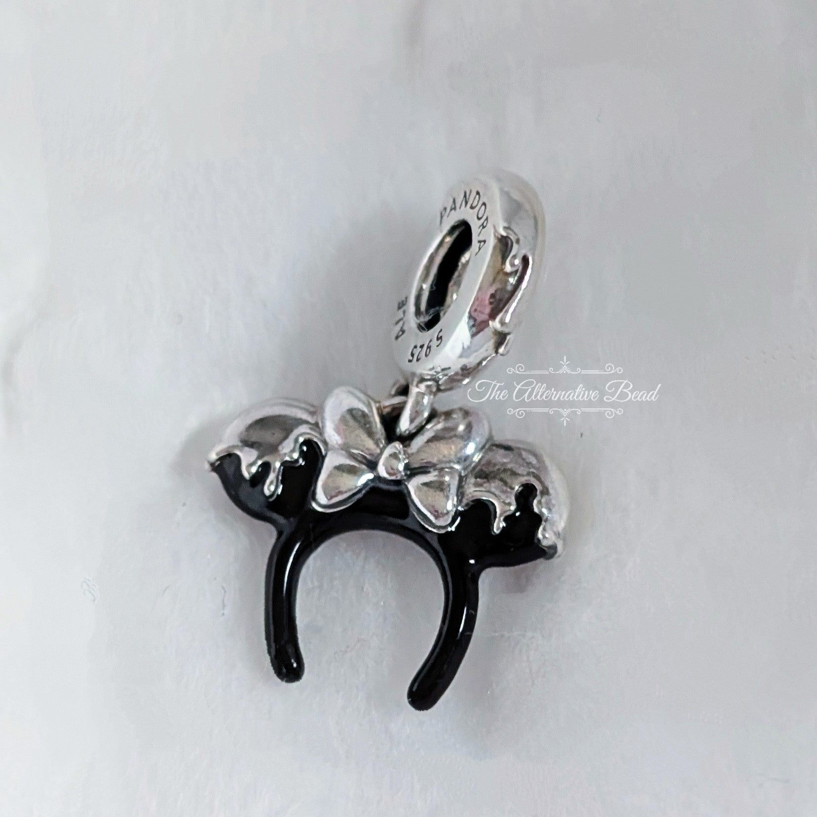 Disney x Pandora Disney 100th Anniversary Minnie Headband Dangle black and silver sterling-silver and enamel Dangle by The Alternative Bead. Your official Disney x Pandora Retailer from Germany