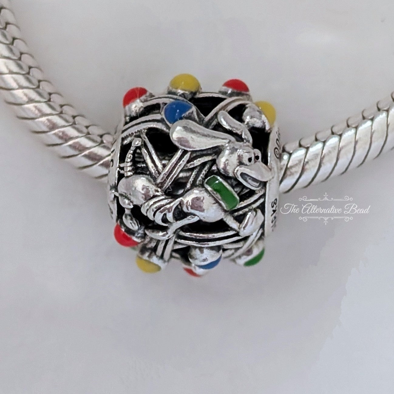 Disney x Pandora Pixar Parks Toy Story Land Charm silver and red and yellow sterling-silver and enamel Bead by The Alternative Bead. Your official Disney x Pandora Retailer from Germany