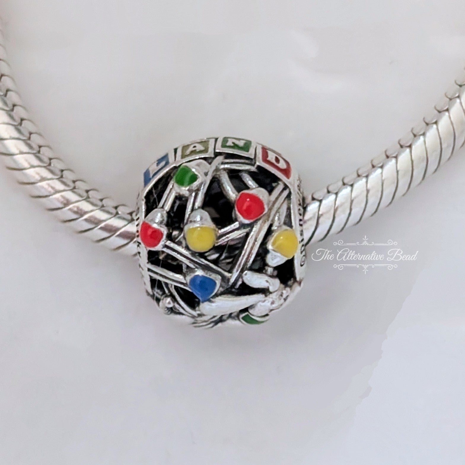 Disney x Pandora Pixar Parks Toy Story Land Charm silver and red and yellow sterling-silver and enamel Bead by The Alternative Bead. Your official Disney x Pandora Retailer from Germany