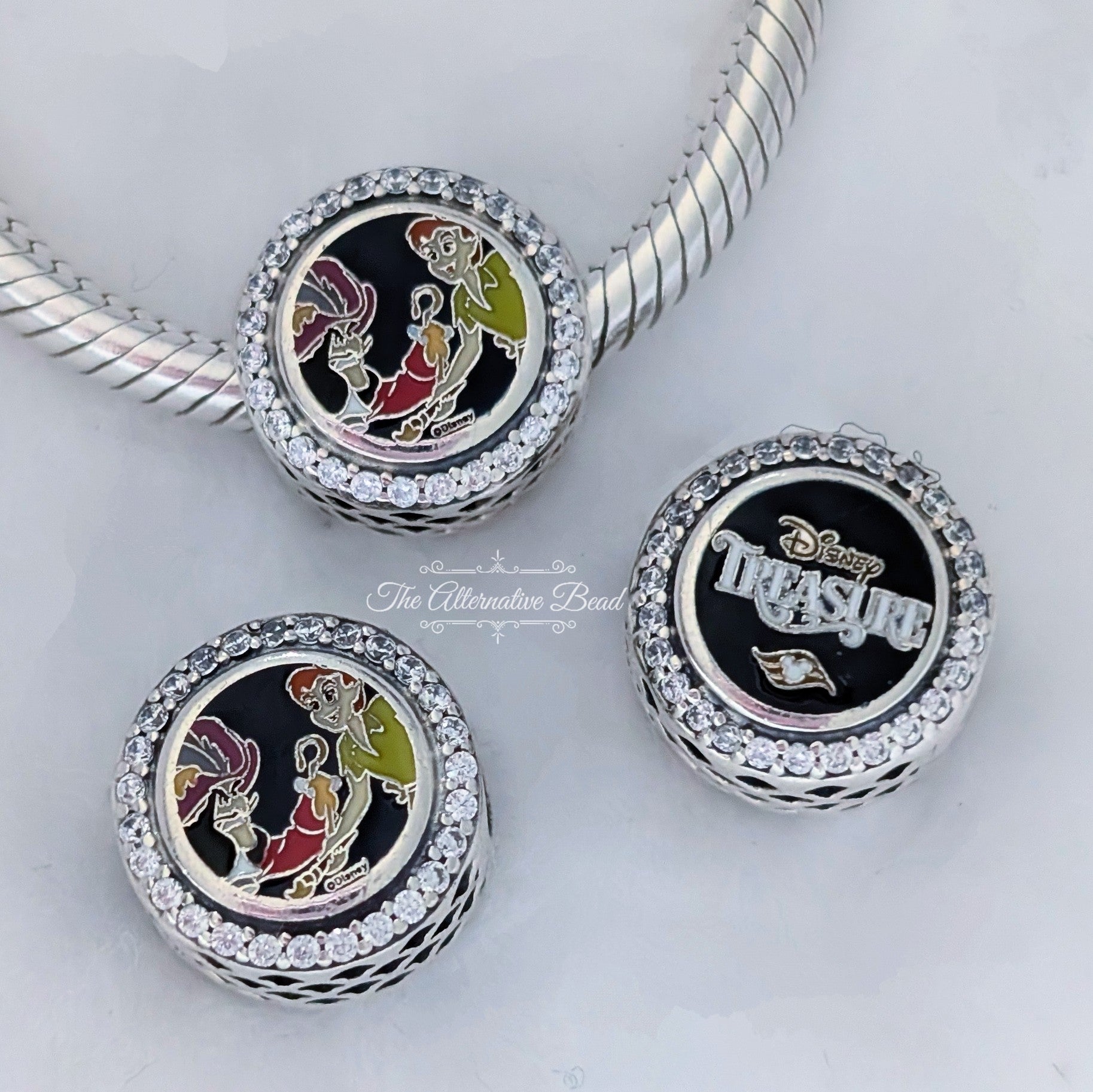 Disney x Pandora Disney Cruise Line Treasure Peter Pan & Captain Hook Charm silver and multicolor and green and red and black sterling-silver and enamel Collectors Set by The Alternative Bead. Your official Disney x Pandora Retailer from Germany