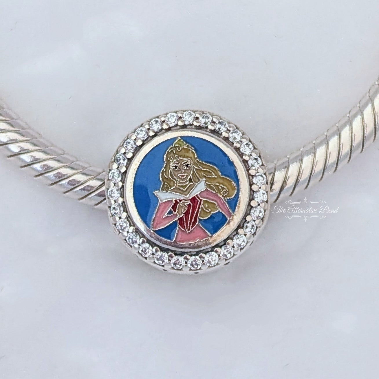 Disney x Pandora RunDisney 2025 Disneyland Princess Half Marathon 13.1k Sleeping Beauty silver and blue and pink sterling-silver and enamel Bead by The Alternative Bead. Your official Disney x Pandora Retailer from Germany