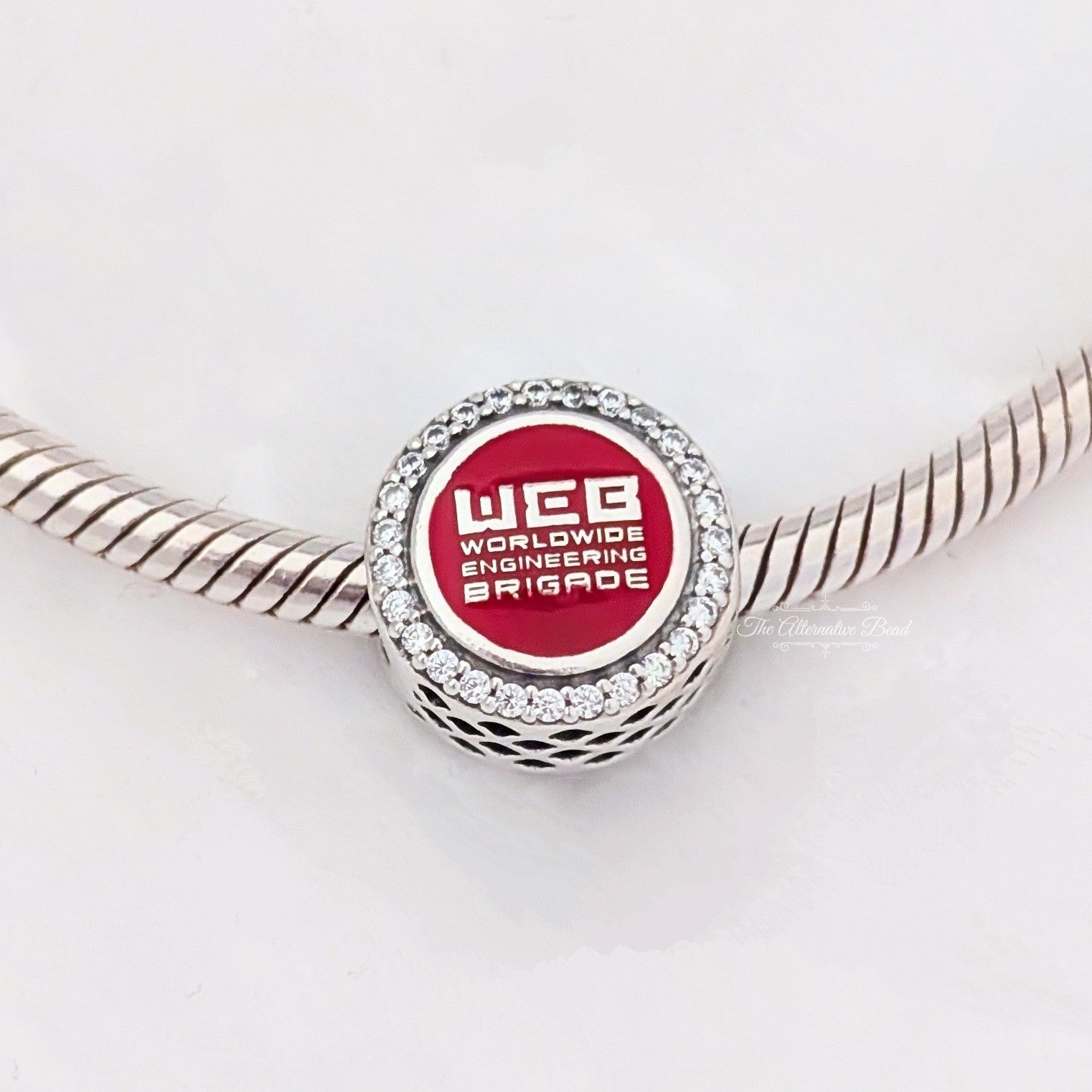 Marvel x Pandora Spider-Man WEB Worldwide Engineering Brigade Charm silver and red and black sterling-silver and enamel Bead by The Alternative Bead. Your official Marvel x Pandora Retailer from Germany