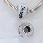 Disney x Pandora Disneyland Glass bead Charm silver and white sterling-silver and glass Bead by The Alternative Bead. Your official Disney x Pandora Retailer from Germany