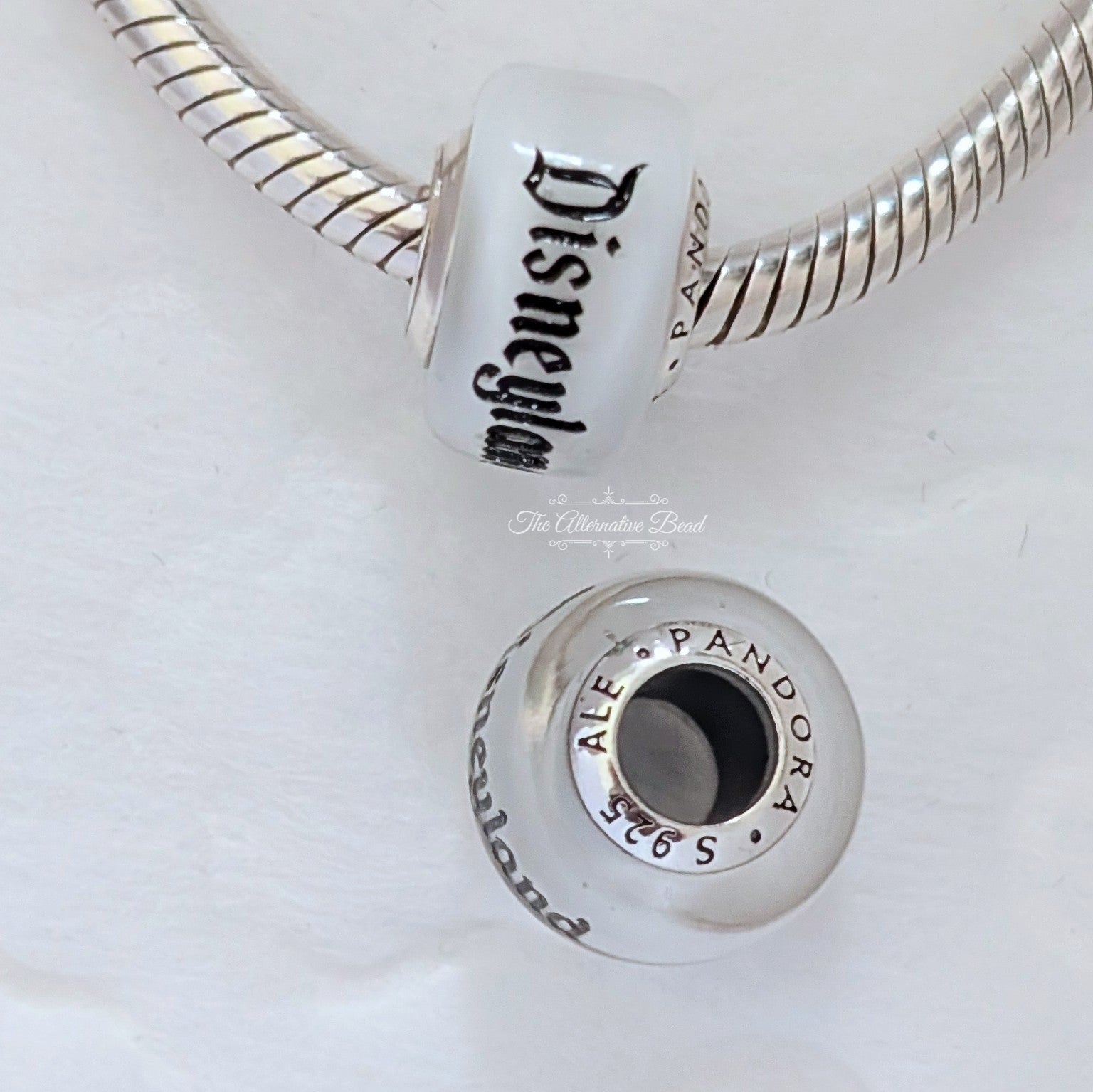 Disney x Pandora Disneyland Glass bead Charm silver and white sterling-silver and glass Bead by The Alternative Bead. Your official Disney x Pandora Retailer from Germany