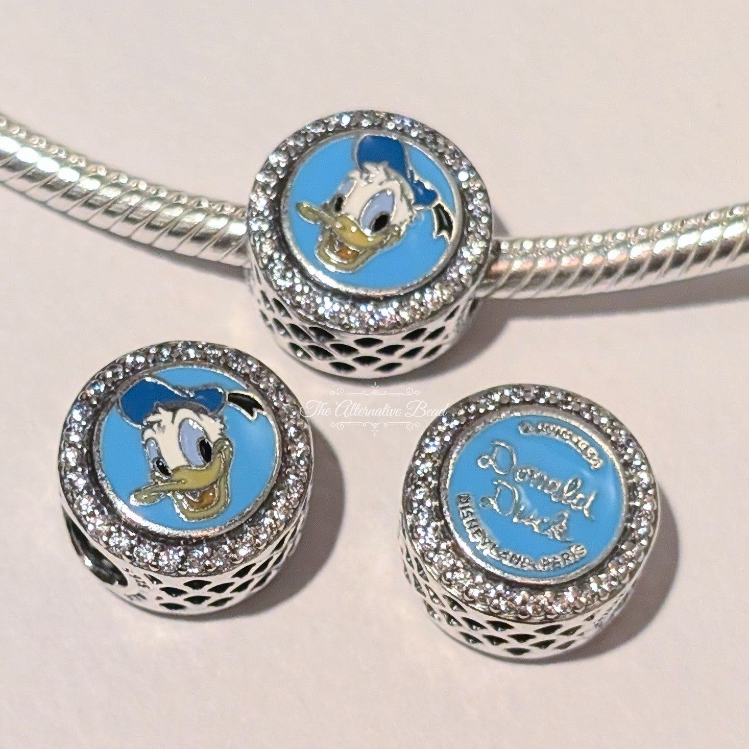 Disney x Pandora Donald Duck Autograph Button Charm silver and blue sterling-silver and enamel Charm by The Alternative Bead Germany