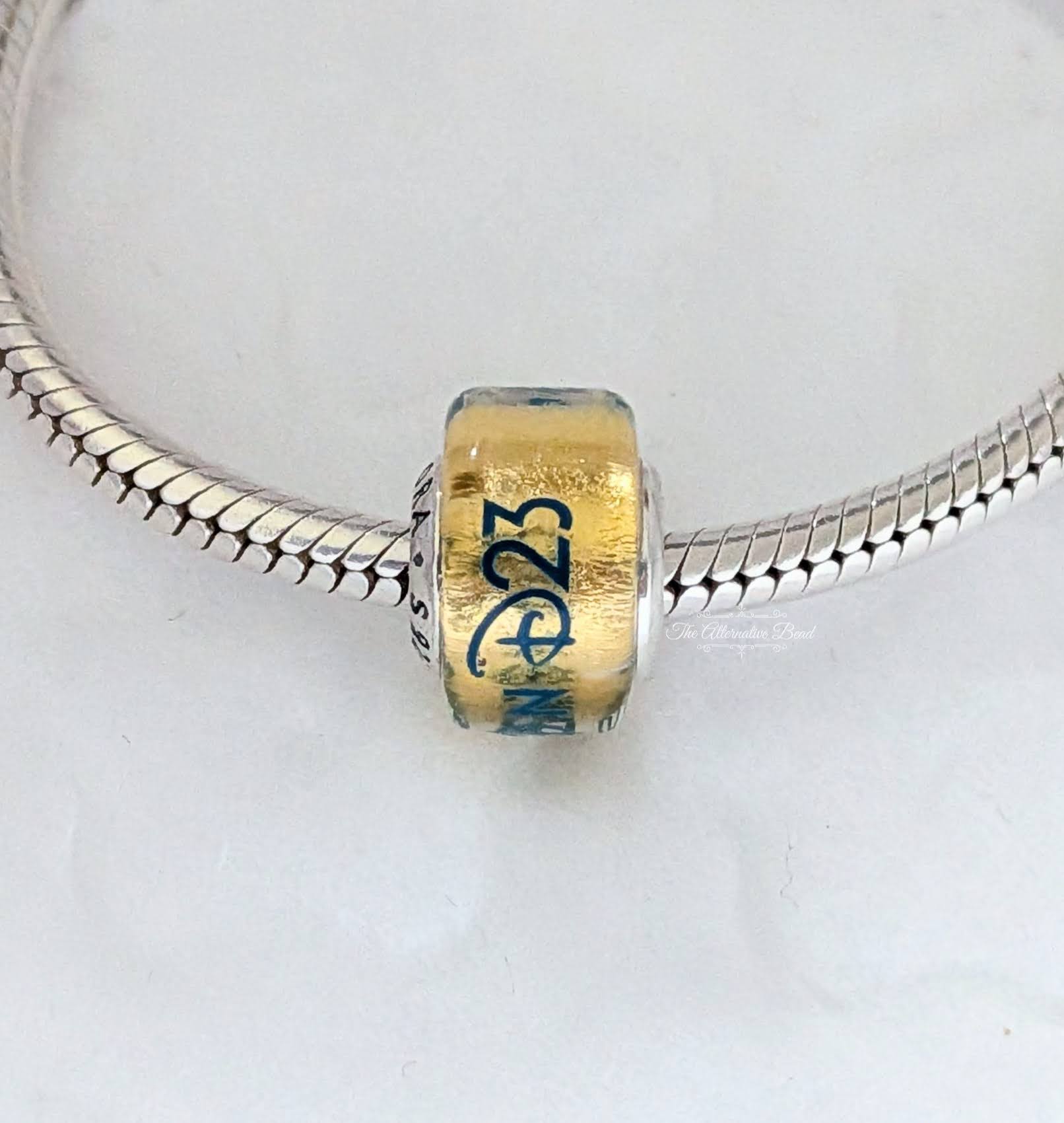 Disney x Pandora Disney Destination D23 2025 exclusive Murano Charm yellow; blue glass Bead by The Alternative Bead. Your Jewelry Retailer from Germany