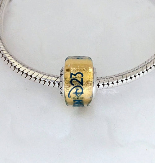 Disney x Pandora Disney Destination D23 2025 exclusive Murano Charm yellow and blue glass Bead by The Alternative Bead. Your Jewelry Retailer from Germany