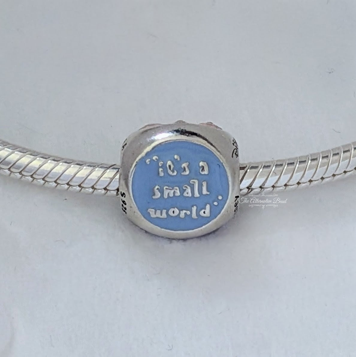 Disney x Pandora It's a Small World Charm retired silver and pink and purple and blue sterling-silver and enamel Bead by The Alternative Bead. Your Jewelry Retailer from Germany