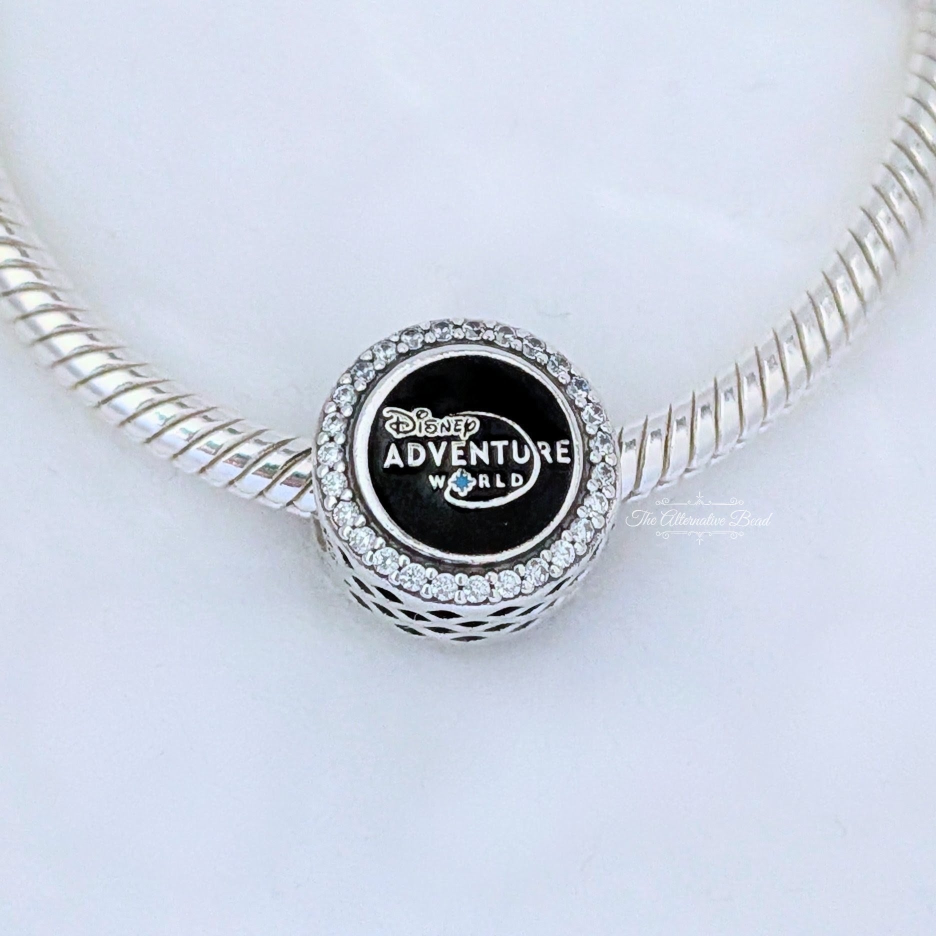 Disney x Pandora Disney Adventure World Logo Button Charm silver; purple; blue sterling-silver; enamel Bead by The Alternative Bead. Your Jewelry Retailer from Germany