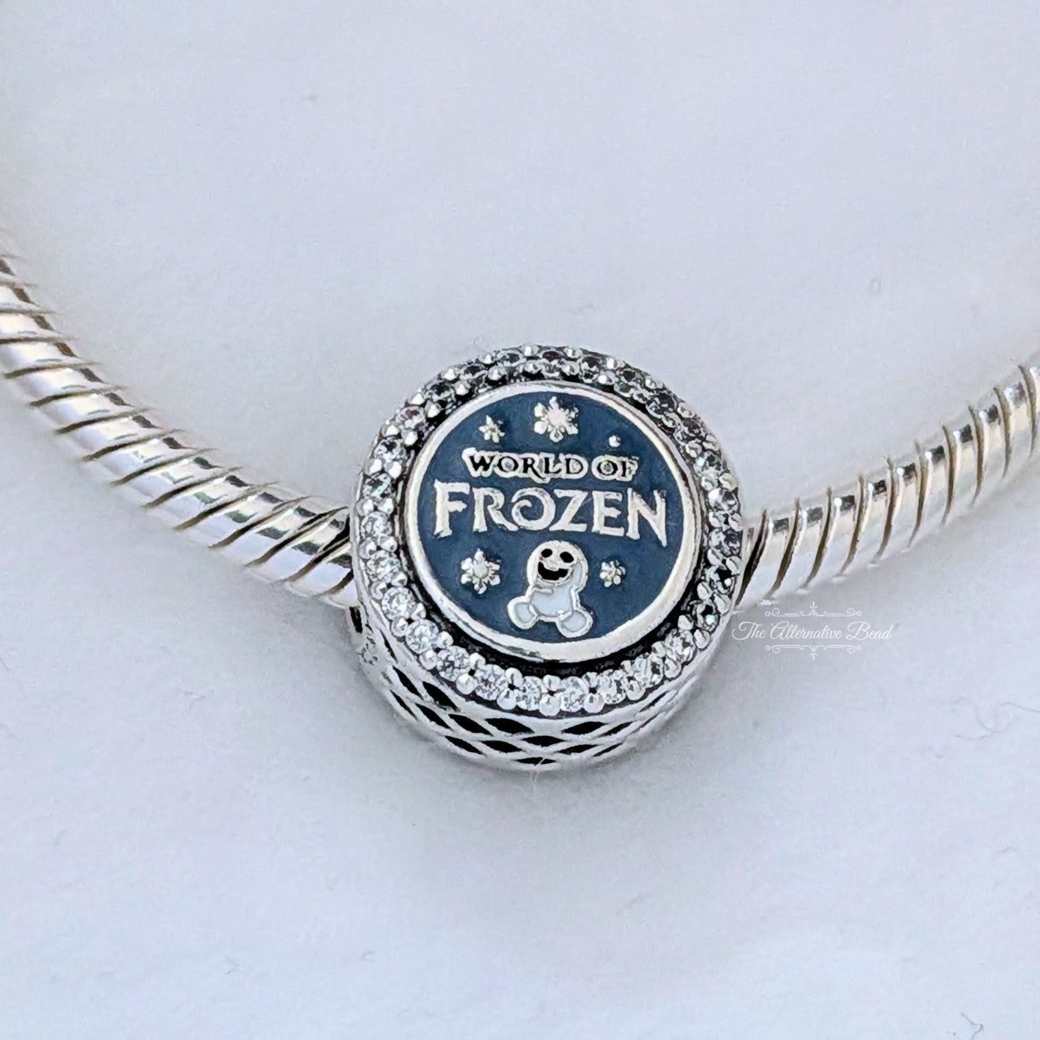 Disney x Pandora Disney World Of Frozen 2026 Button Charm silver; blue; white sterling-silver; enamel Bead by The Alternative Bead. Your Jewelry Retailer from Germany