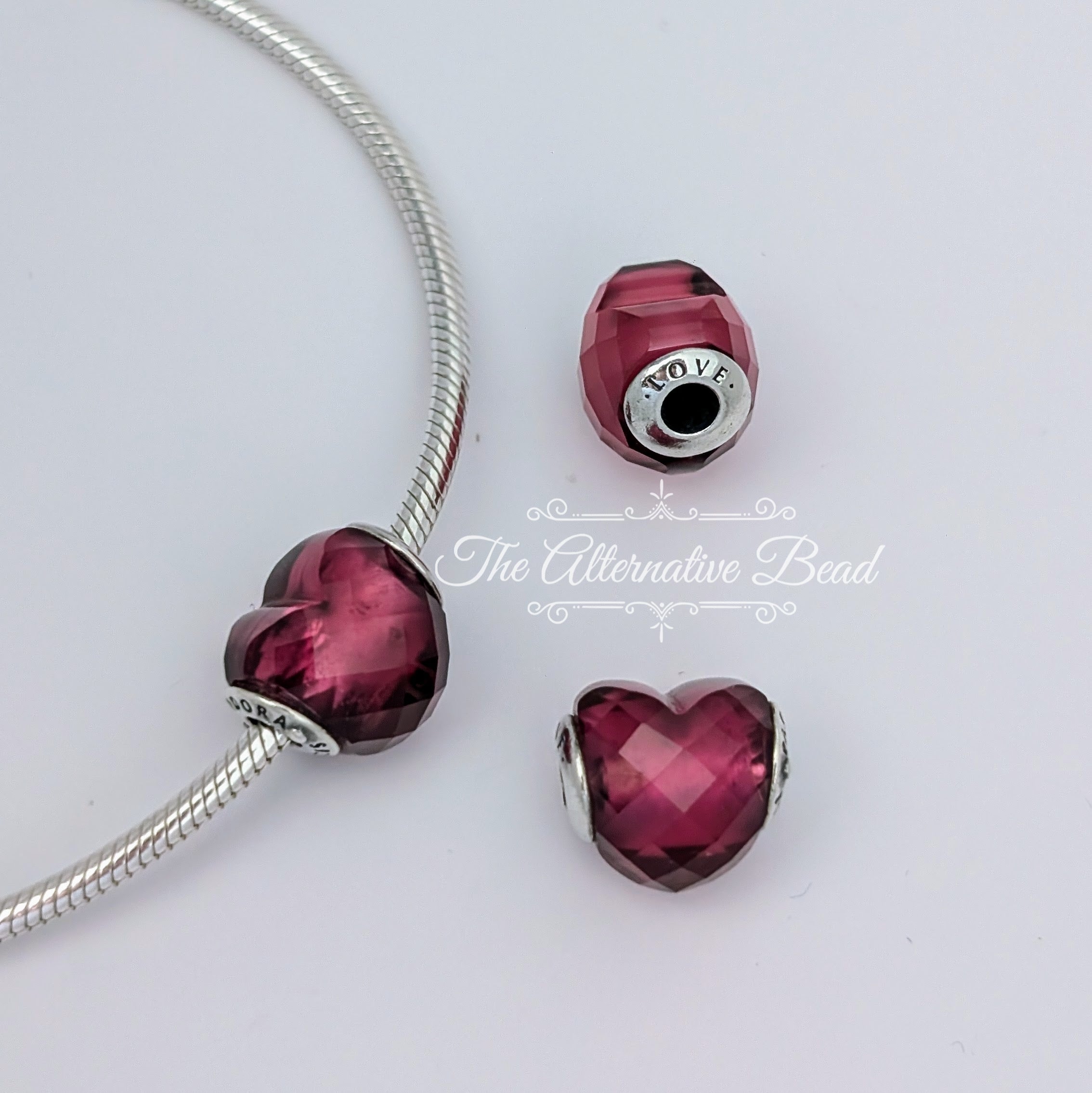 Pandora Sterling Silver Essence Love Heart Charm Fuchsia Faceted Crystal (796600NFR) pink glass Bead by The Alternative Bead. Your Jewelry Retailer from Germany