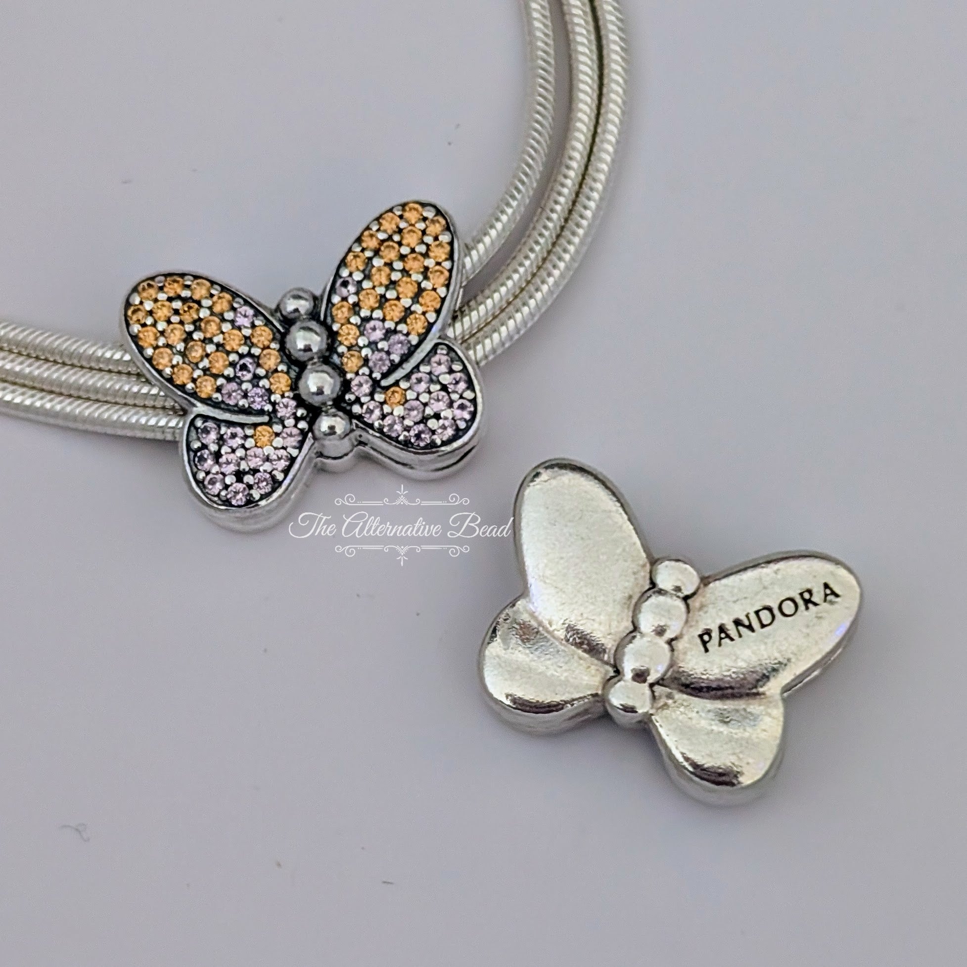 Pandora Reflexions Bedazzling Butterfly Clip (797864CZM) silver and pink and yellow sterling-silver and crystal Clip by The Alternative Bead. Your Jewelry Retailer from Germany