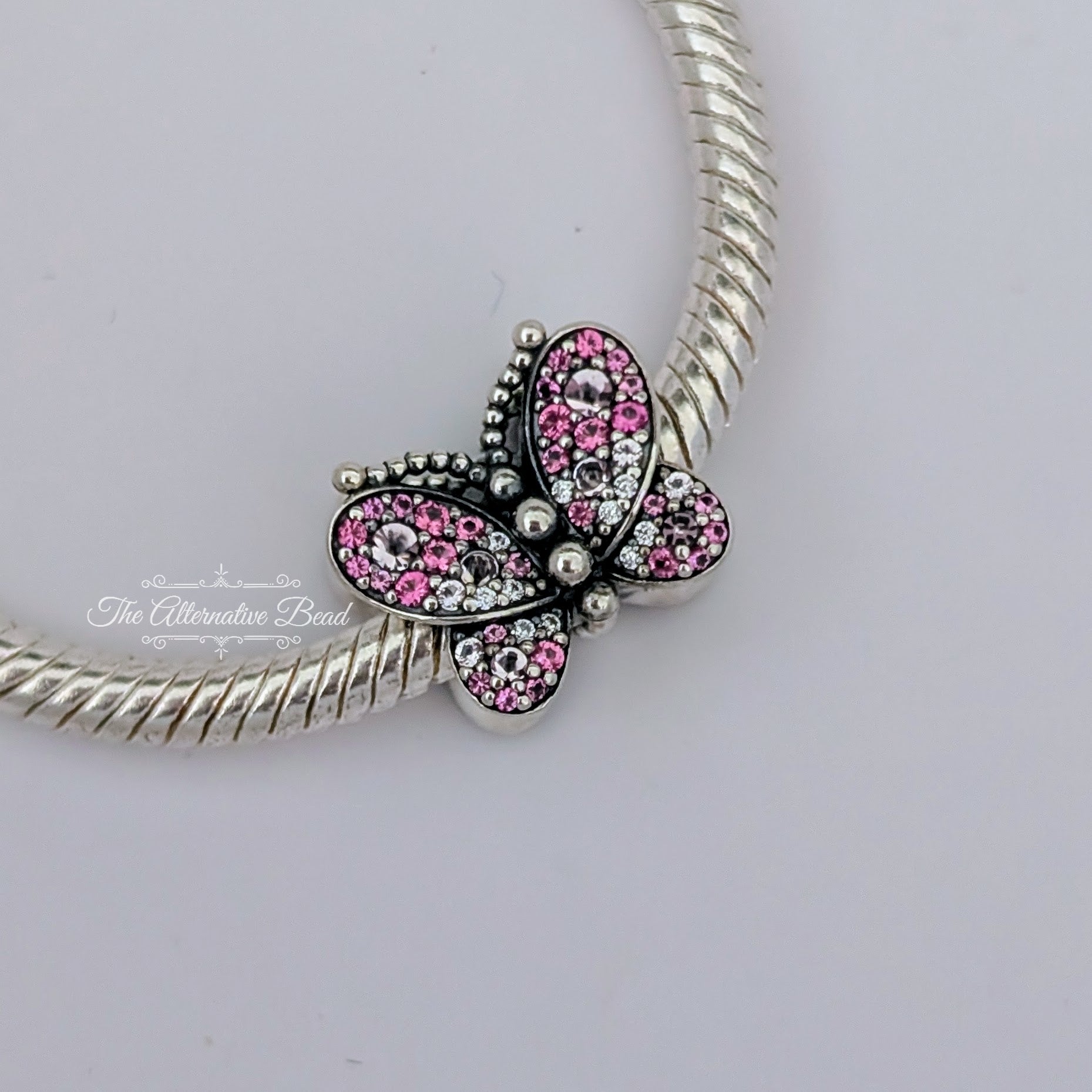 Pandora Dazzling Pink Butterfly Charm (797882NCCMX) silver and pink sterling-silver and crystal Bead by The Alternative Bead. Your Jewelry Retailer from Germany