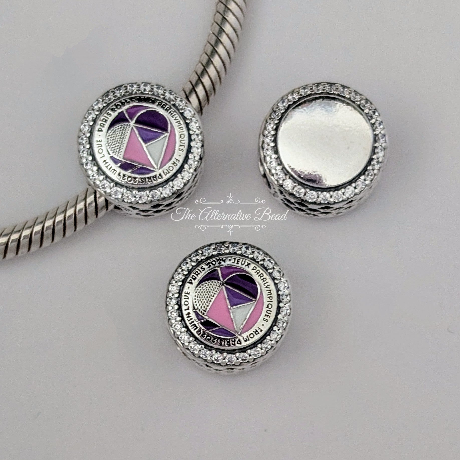 Pandora Engravable Charm Paris 2024 Paralympic Games (792016CZ_E061) silver and purple and pink sterling-silver Bead by The Alternative Bead. Your Jewelry Retailer from Germany