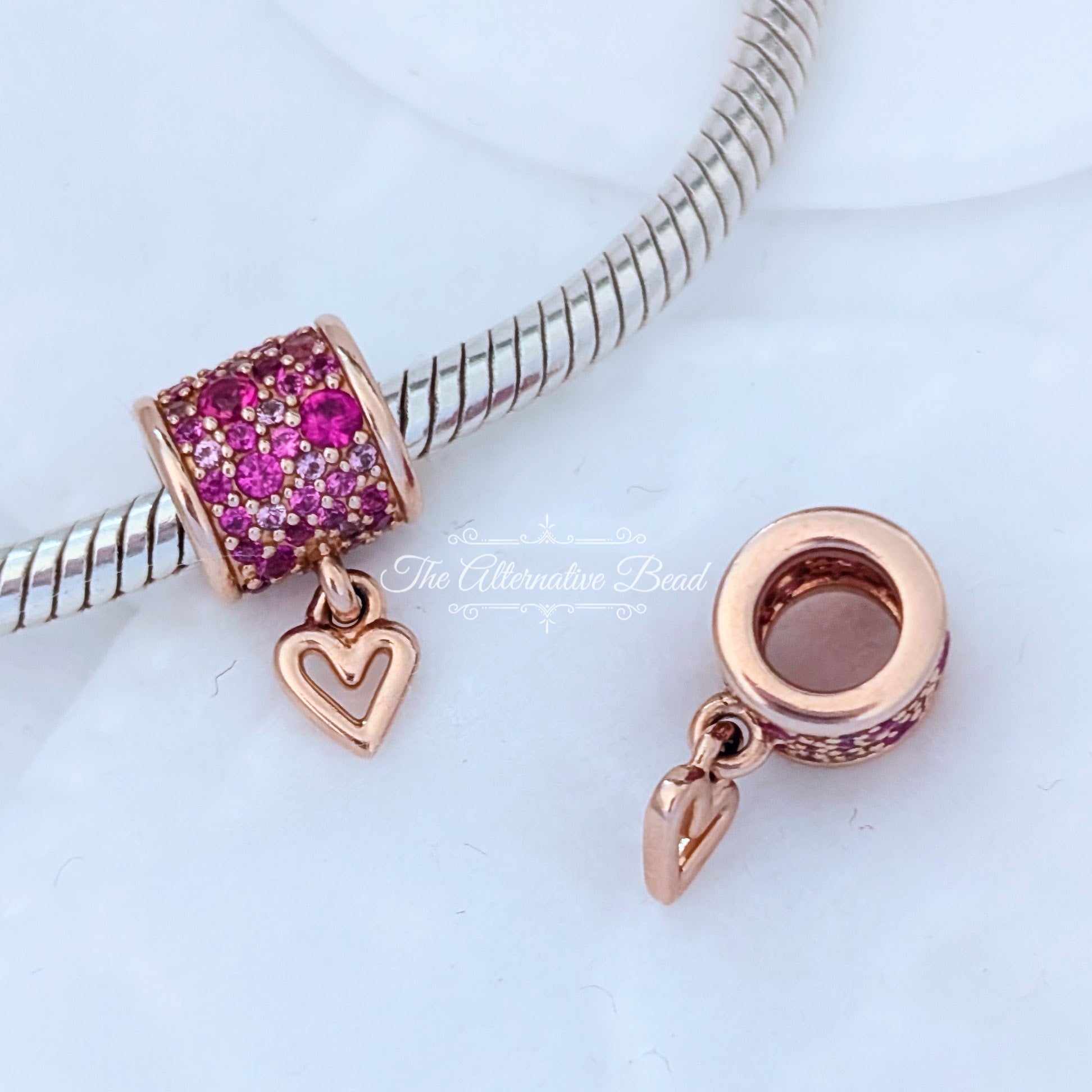 Pandora Retired 14K Rose Gold-Plated Freehand Heart Barrel Charm with Synthetic Red Ruby (789548C01) rose-gold and pink and red sterling-silver and rose-gold Bead by The Alternative Bead. Your Jewelry Retailer from Germany