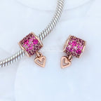 Pandora Retired 14K Rose Gold-Plated Freehand Heart Barrel Charm with Synthetic Red Ruby (789548C01) rose-gold and pink and red sterling-silver and rose-gold Bead by The Alternative Bead. Your Jewelry Retailer from Germany
