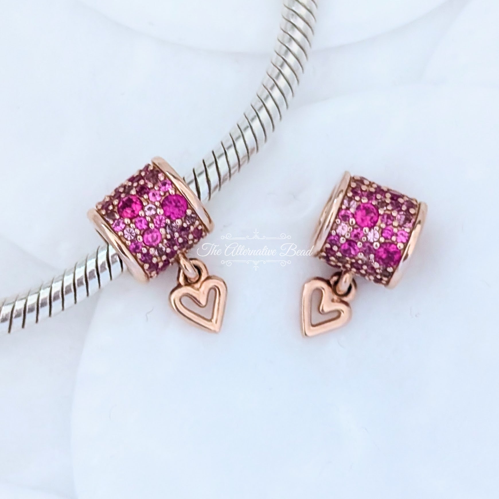 Pandora Retired 14K Rose Gold-Plated Freehand Heart Barrel Charm with Synthetic Red Ruby (789548C01) rose-gold and pink and red sterling-silver and rose-gold Bead by The Alternative Bead. Your Jewelry Retailer from Germany