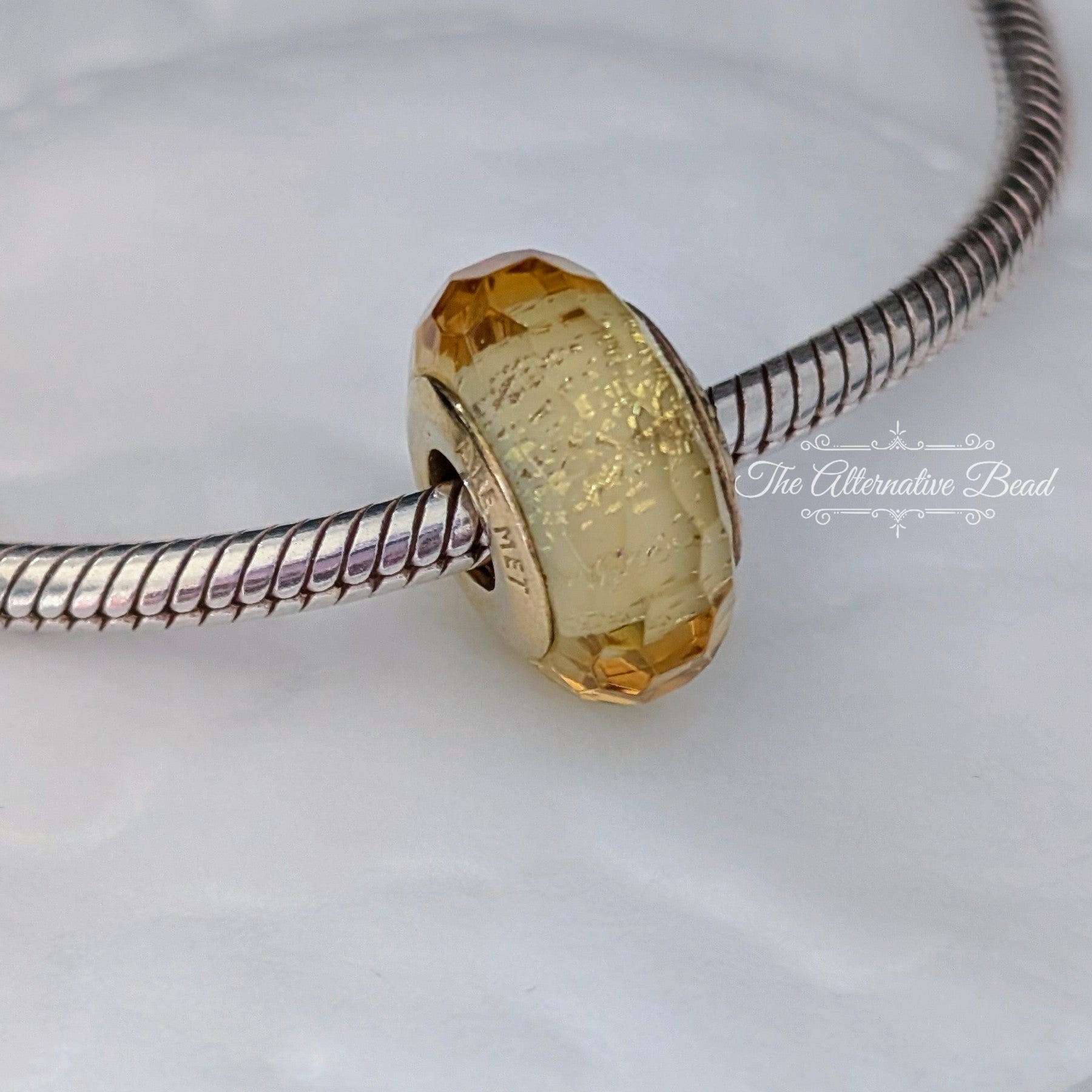 Pandora Faceted Golden Murano Glass Charm (767647) yellow and gold glass and gold Bead by The Alternative Bead. Your Jewelry Retailer from Germany