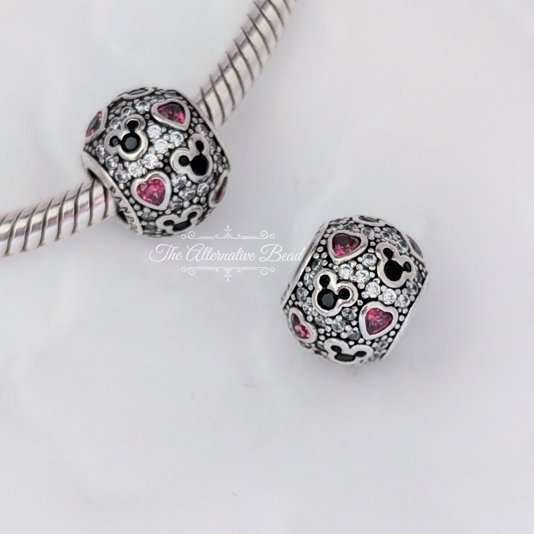 Disney x Pandora Sparkling Mickey & Hearts Charm (791457CZ) black and pink and silver sterling-silver Bead by The Alternative Bead. Your Jewelry Retailer from Germany