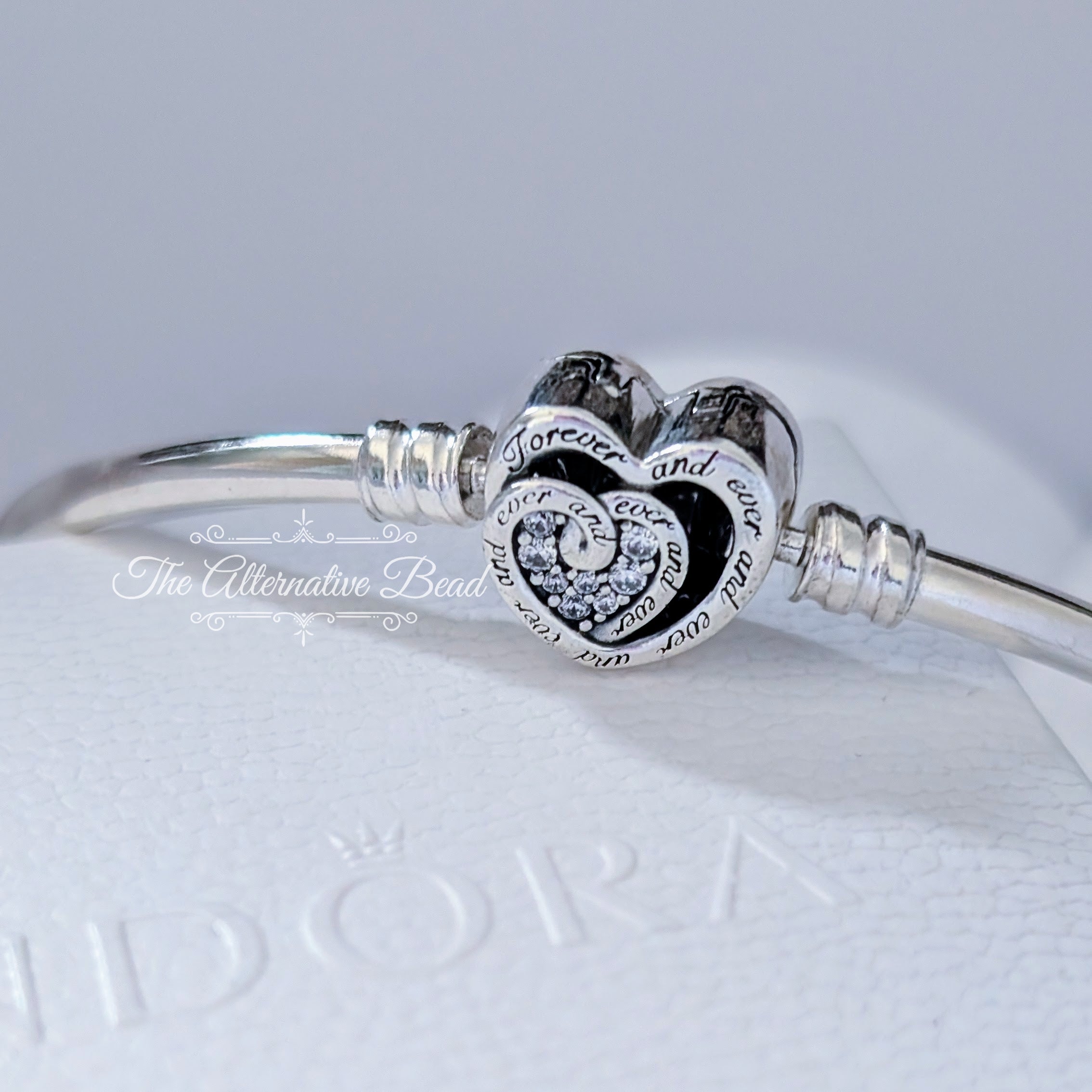 Pandora Moments Entwined Infinite Hearts Clasp Bangle (591064C01) silver sterling-silver Bangle by The Alternative Bead. Your Jewelry Retailer from Germany