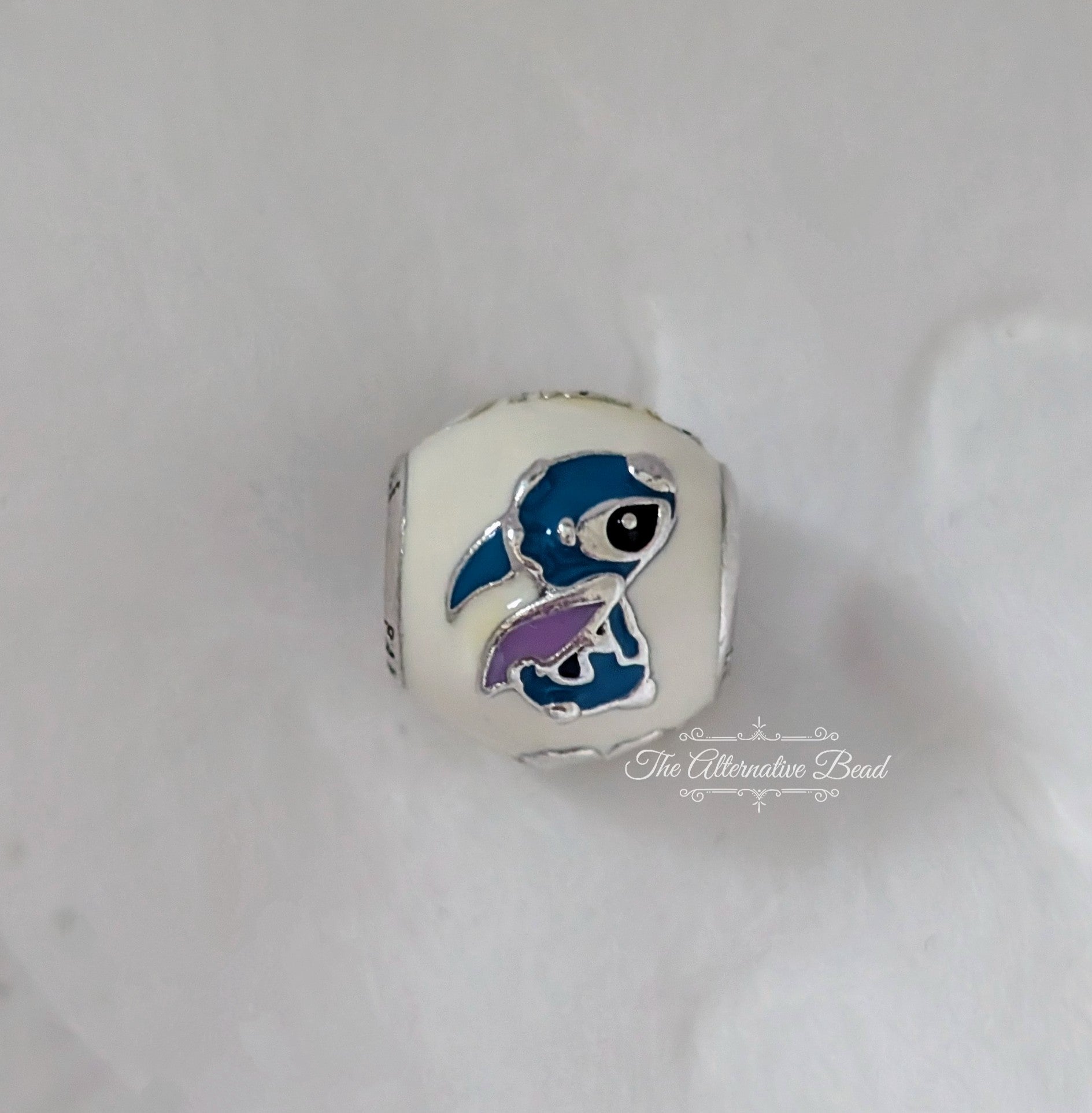 Disney x Pandora Lilo & Stitch Charm with White Enamel (796338ENMX) white and blue and red and black and purple enamel and sterling-silver Bead by The Alternative Bead. Your Jewelry Retailer from Germany