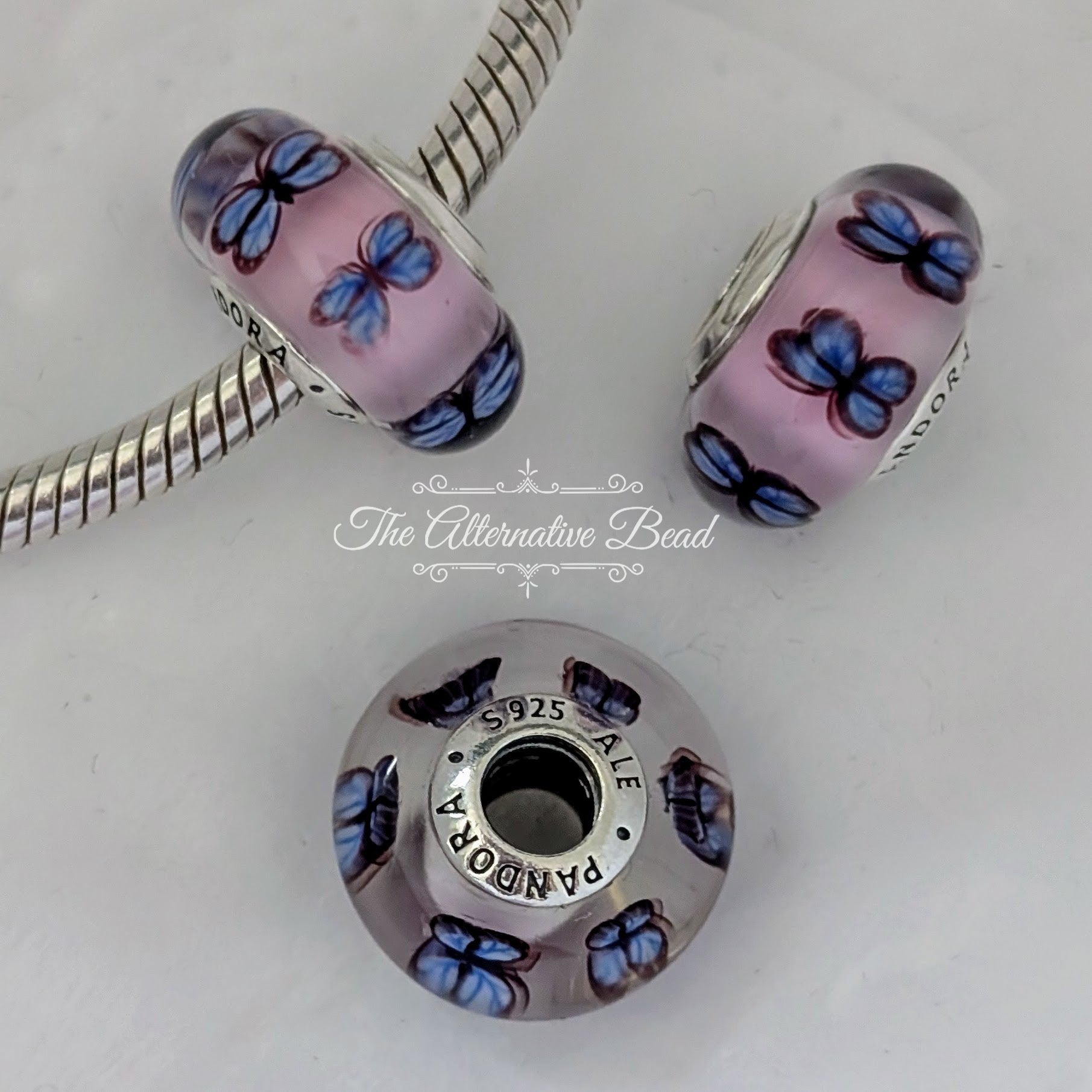 Pandora Butterfly Pink Murano Glass Charm (797893) pink and purple glass Bead by The Alternative Bead. Your Jewelry Retailer from Germany