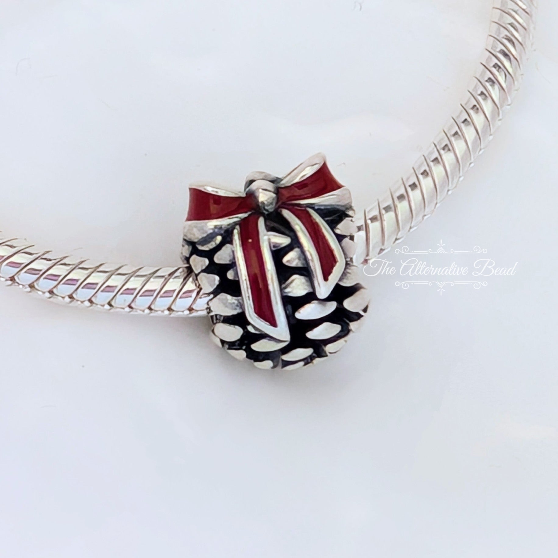 Pandora Pinecone Bow Charm (791237EN39) red and silver sterling-silver and enamel Bead by The Alternative Bead. Your Jewelry Retailer from Germany