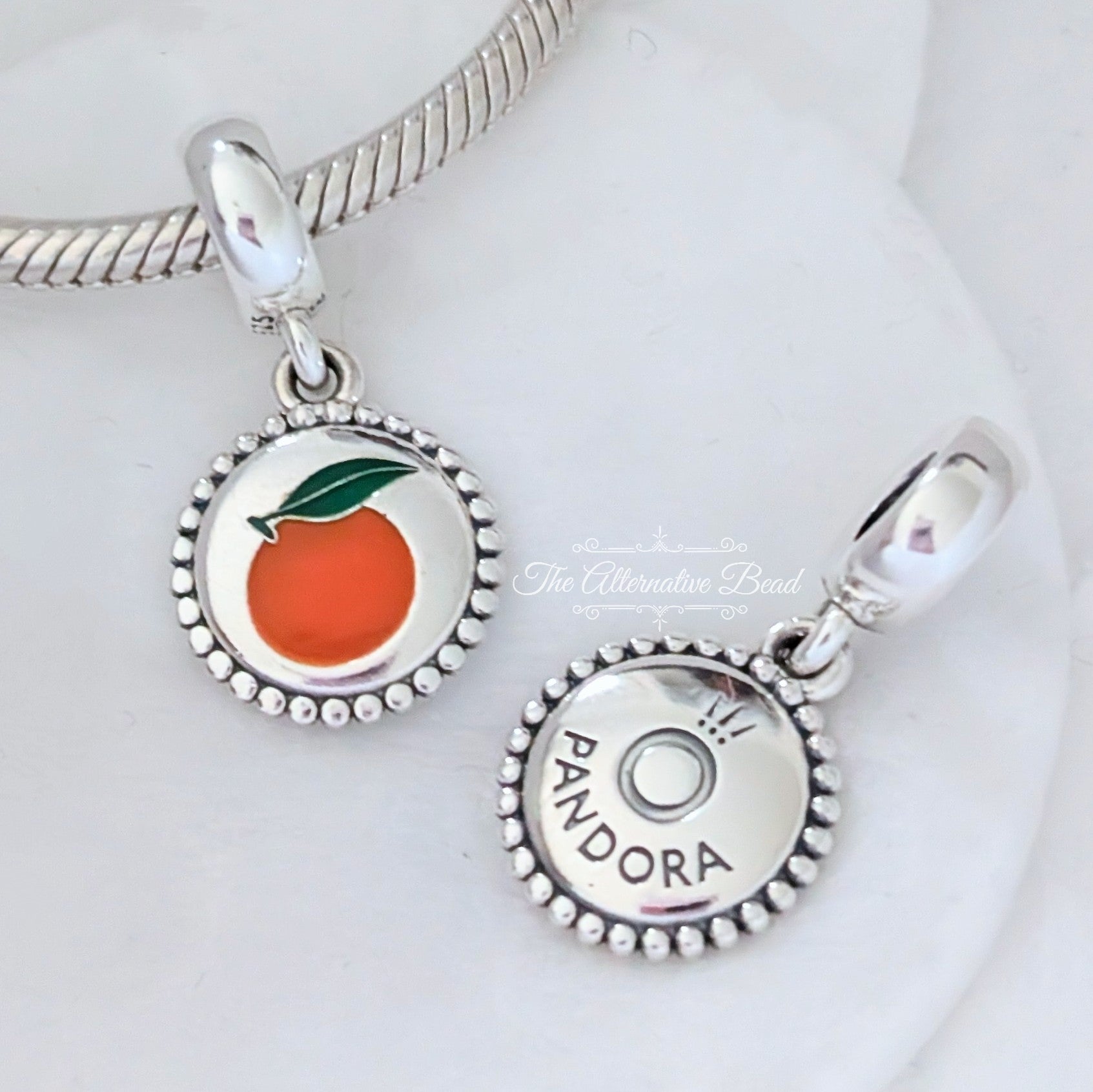 Pandora Orange Dangle Charm (791169C00_E026) silver and orange sterling-silver and enamel Dangle by The Alternative Bead. Your Jewelry Retailer from Germany