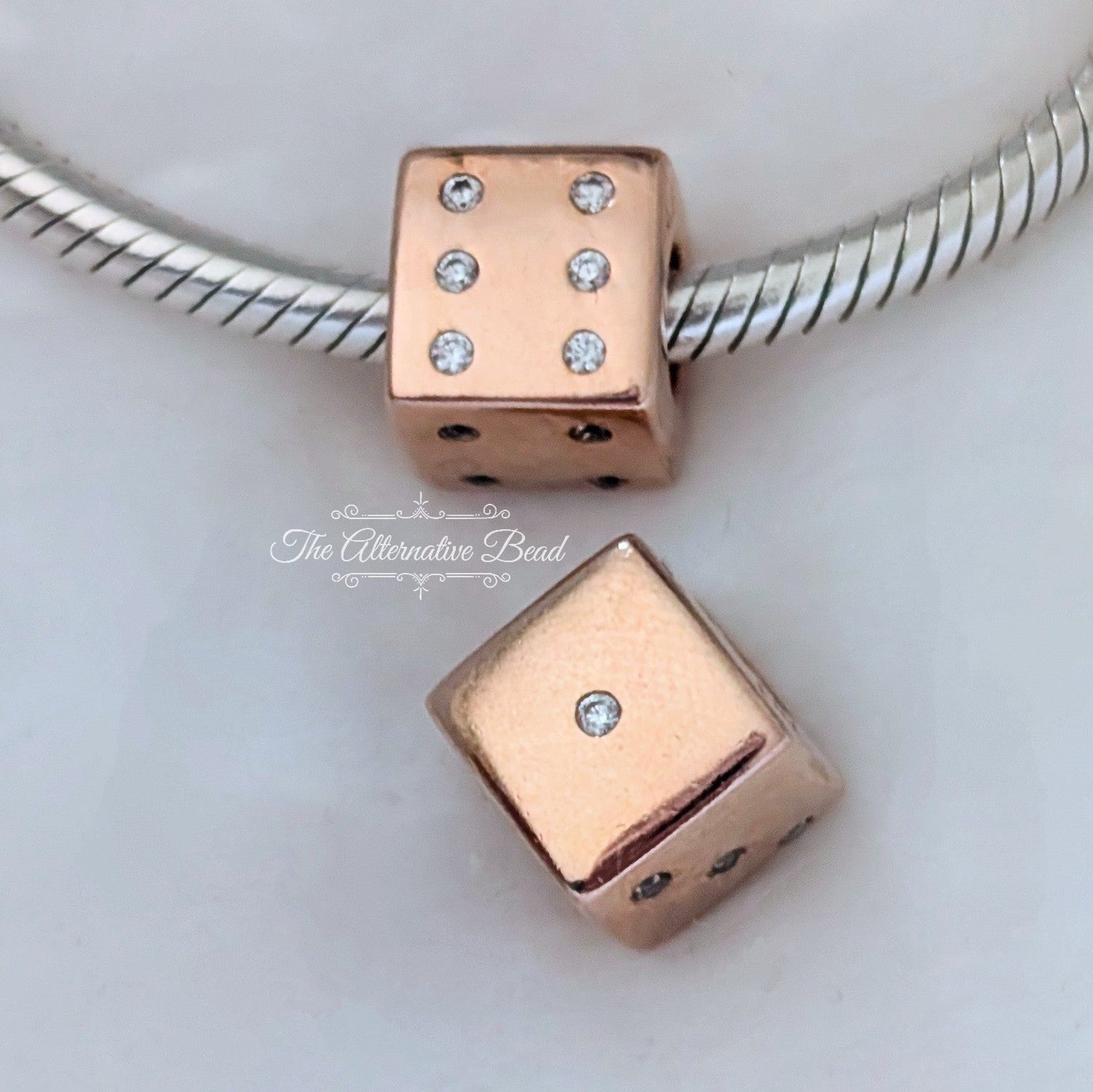 Pandora Sparkling Dice Charm (781269C01) rose-gold sterling-silver and rose-gold Bead by The Alternative Bead. Your Jewelry Retailer from Germany