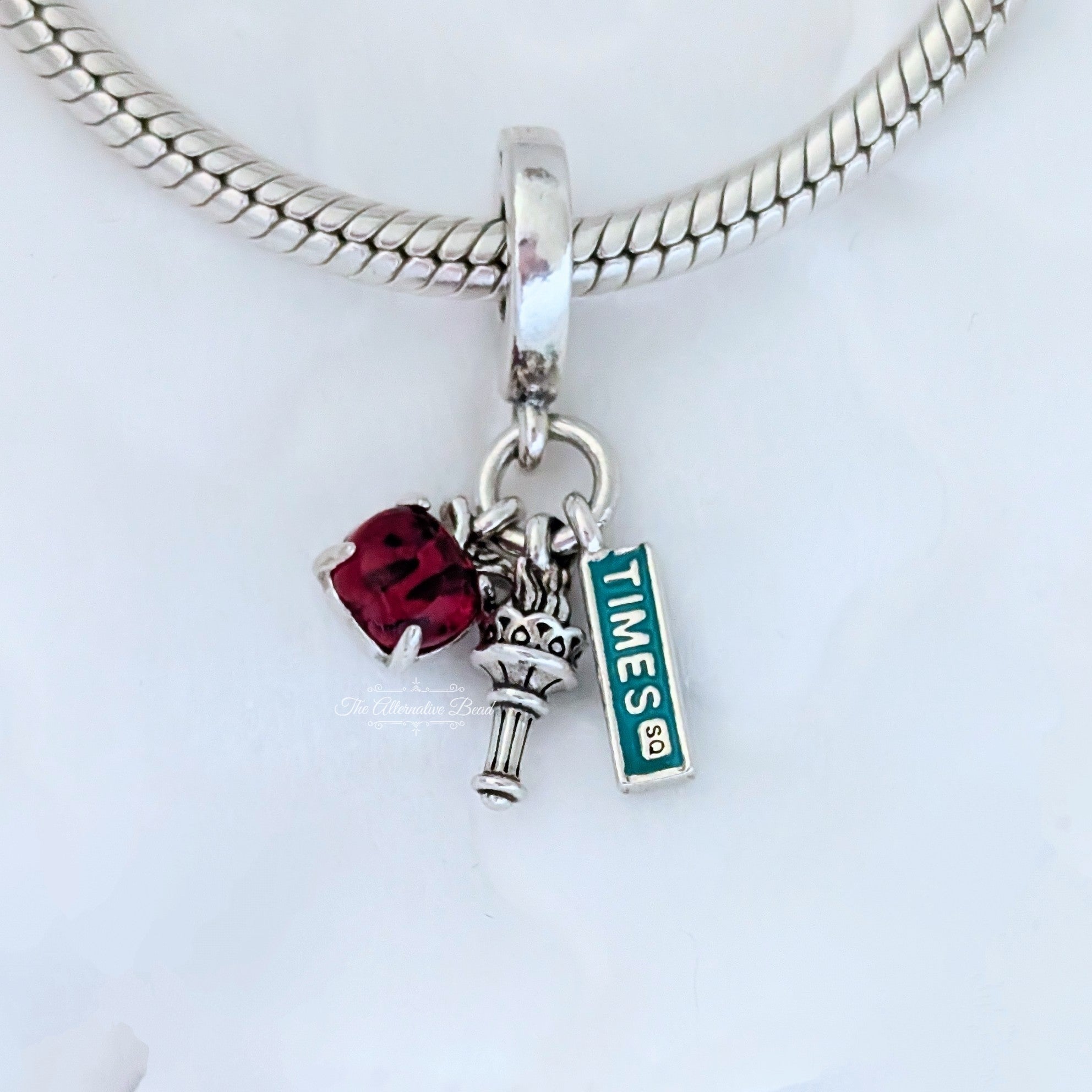 Pandora NYC Apple, Torch and Street Sign Triple Dangle (792718C01) silver and multicolor sterling-silver and enamel Dangle by The Alternative Bead. Your Jewelry Retailer from Germany