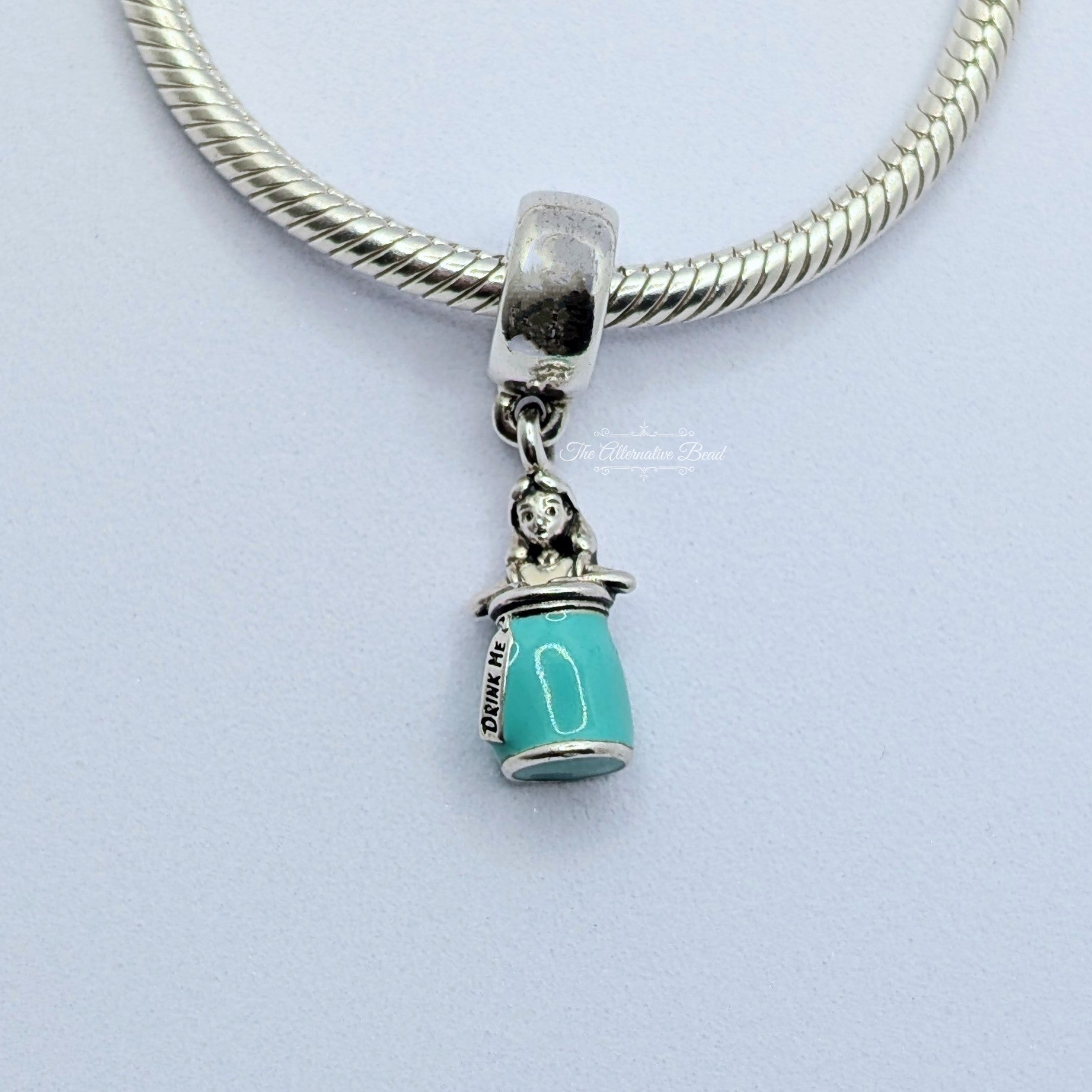 Disney x Pandora Disney Alice in Wonderland Drink Me Dangle Charm (First Version) (799334C01) blue and white and green sterling-silver and enamel Dangle by The Alternative Bead. Your Jewelry Retailer from Germany
