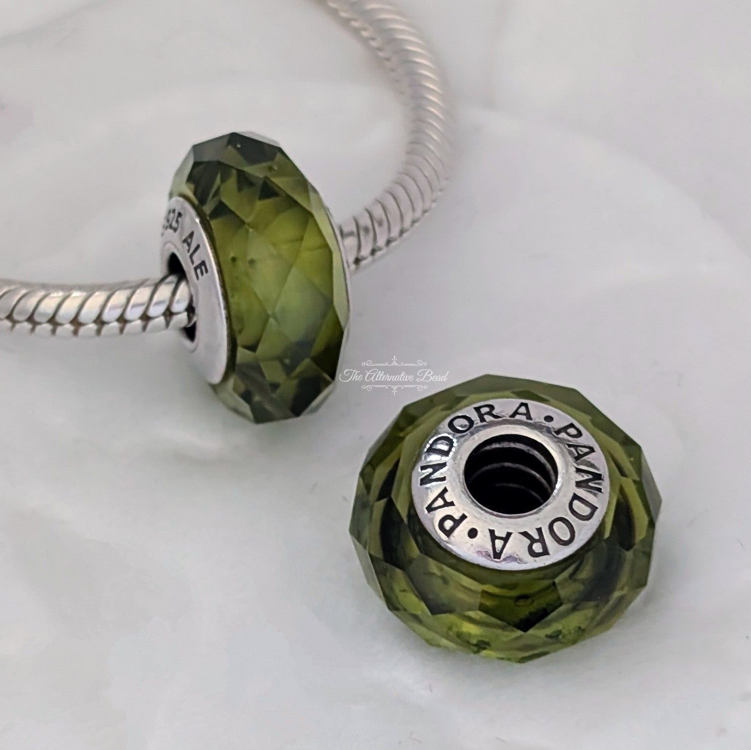 Pandora Olive Green Faceted Murano (791729NLG) green glass Bead by The Alternative Bead. Your Jewelry Retailer from Germany