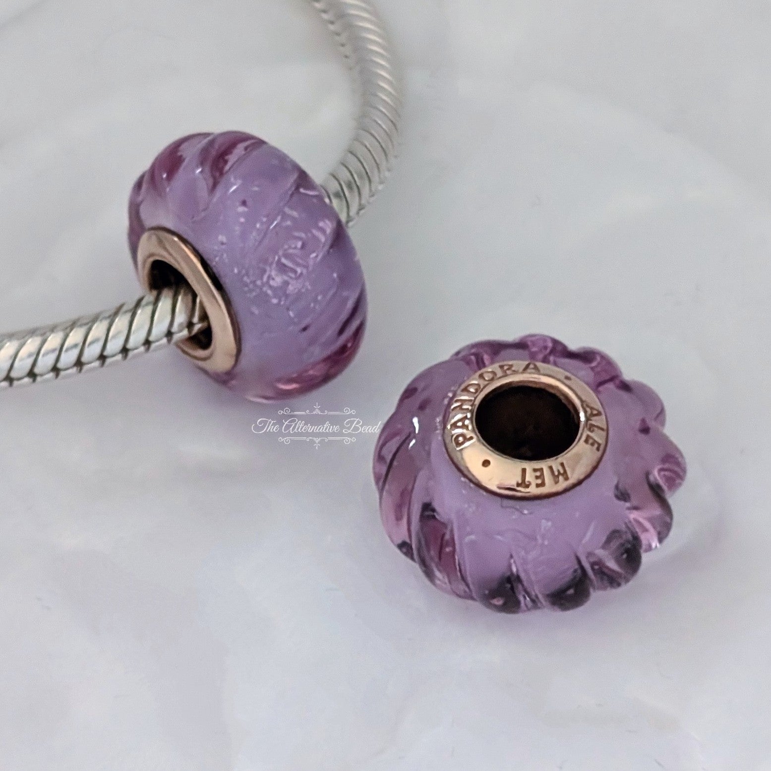 Pandora Groove 14k rose gold-plated charm with iridescent, pink and purple Murano glass (788107) purple glass and rose-gold Bead by The Alternative Bead. Your Jewelry Retailer from Germany