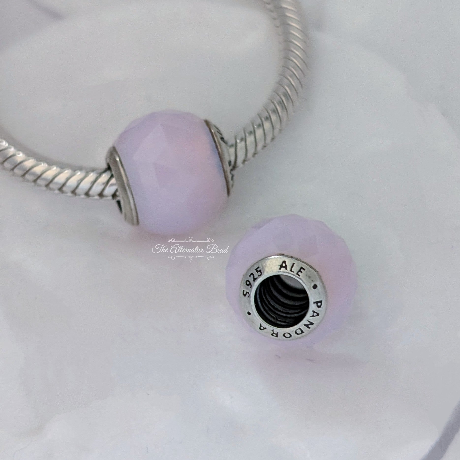 Pandora Opalescent Pink Geometric Facets Charm (791722NOP) pink glass Bead by The Alternative Bead. Your Jewelry Retailer from Germany